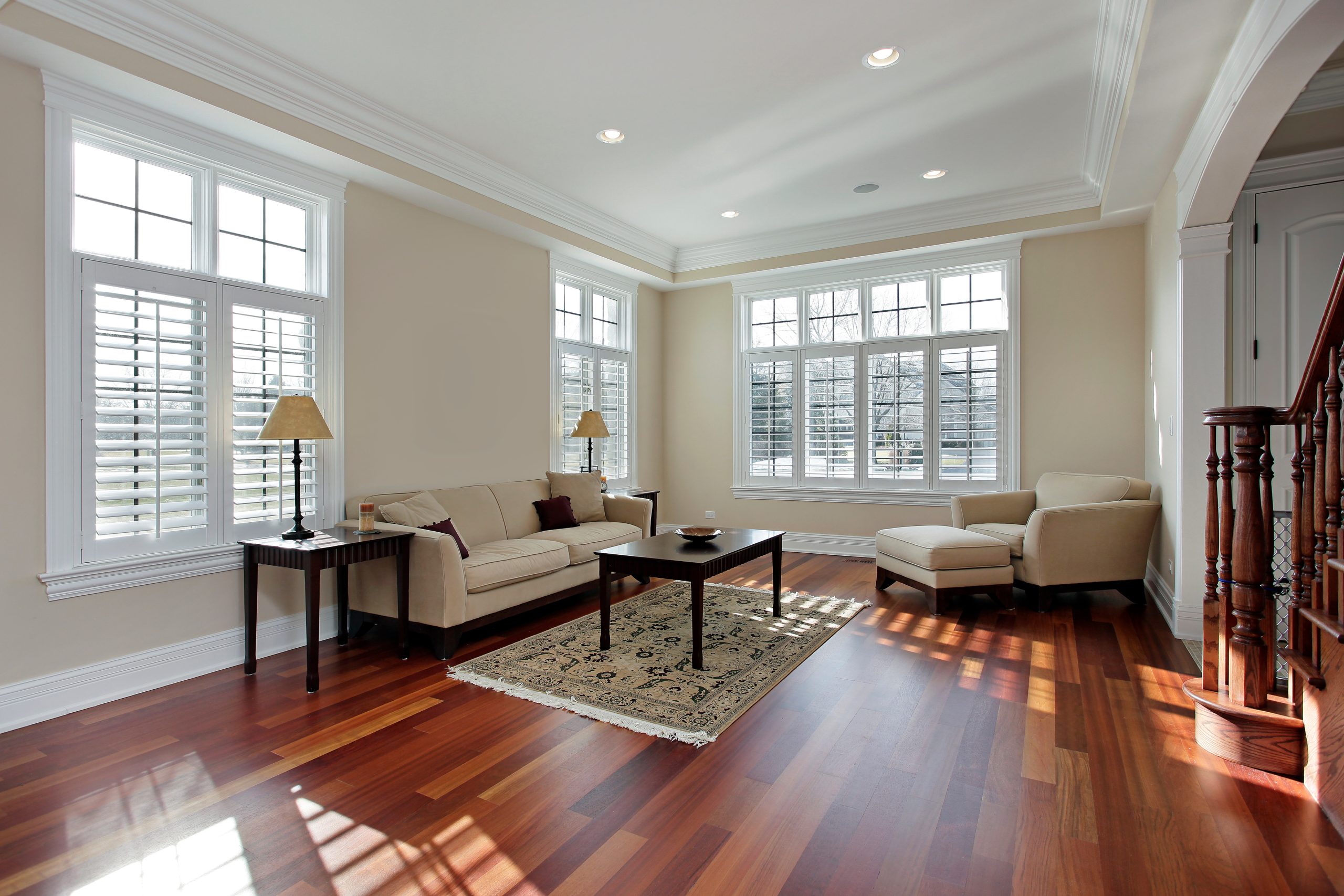 Freshly painted living room with white trim and crown molding
