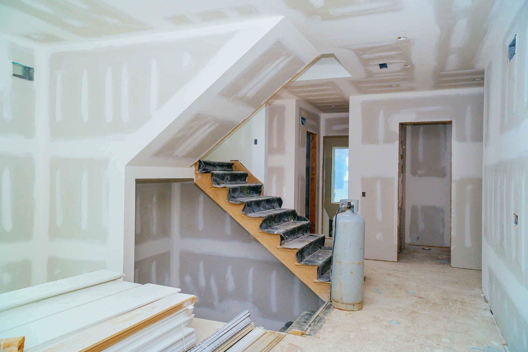 Newly hung and taped drywall throughout a home interior
